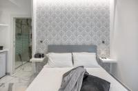 A bed or beds in a room at Maison Marienne - Deluxe B&B