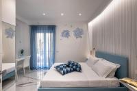 A bed or beds in a room at Maison Marienne - Deluxe B&B