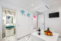 A television and/or entertainment centre at Maison Marienne - Deluxe B&B