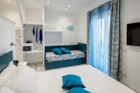 A bed or beds in a room at Maison Marienne - Deluxe B&B