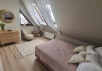 Posteľ alebo postele v izbe v ubytovaní Uroczy Penthouse