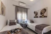 Posteľ alebo postele v izbe v ubytovaní Estia Apartment