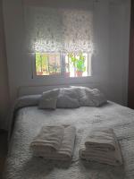 Posteľ alebo postele v izbe v ubytovaní Apto. planta baja y cochera barrio San Basilio