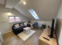 Televízia a/alebo spoločenská miestnosť v ubytovaní Apartmani Nova