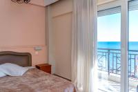 Postel nebo postele na pokoji v ubytování Hotel Alkyon
