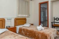 Postel nebo postele na pokoji v ubytování Hotel Alkyon