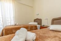 Postel nebo postele na pokoji v ubytování Hotel Alkyon