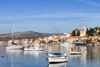 a group of boats sitting in the water in a harbor at Apartments Lias - with restaurant in Rogoznica