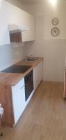 Kuchyňa alebo kuchynka v ubytovaní Apartman LAMI