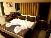 Postel nebo postele na pokoji v ubytování Arya Apart Kundu Hotel