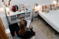 A bed or beds in a room at Hostal Santa Cruz
