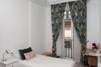A bed or beds in a room at Hostal Santa Cruz