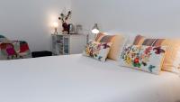 A bed or beds in a room at Hostal Santa Cruz