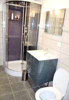 a bathroom with a shower and a toilet and a sink at Maison de 5 chambres avec jardin amenage a Les Vans in Les Vans