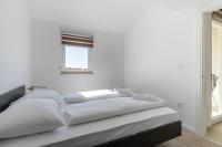 Postel nebo postele na pokoji v ubytování Sunrise Apartment