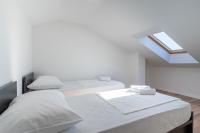 Postel nebo postele na pokoji v ubytování Sunrise Apartment