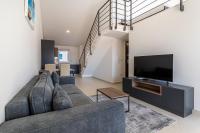 TV a/nebo společenská místnost v ubytování Sunrise Apartment