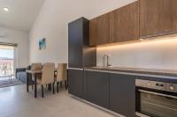 Kuchyň nebo kuchyňský kout v ubytování Sunrise Apartment