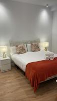 Łóżko lub łóżka w pokoju w obiekcie ARENA Apartamento - Perla Boutique Apartamentos