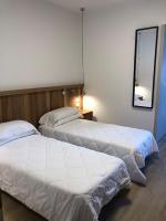 Posteľ alebo postele v izbe v ubytovaní Hotel Oliva