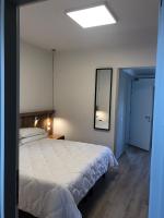 Posteľ alebo postele v izbe v ubytovaní Hotel Oliva