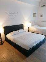 A bed or beds in a room at La Dimora del Conte