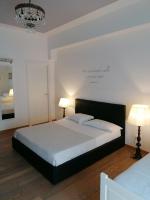 A bed or beds in a room at La Dimora del Conte