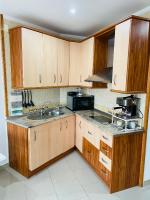Kuchyň nebo kuchyňský kout v ubytování Apartamento La Torre 1337 Precioso, moderno y con piscina