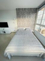 Postel nebo postele na pokoji v ubytování Apartamento La Torre 1337 Precioso, moderno y con piscina