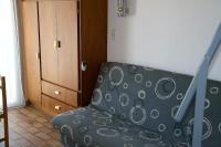 a polka dot chair in a room with a door at Studio avec vue sur la mer et balcon amenage a Le Barcares in Le Barcarès