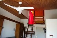 a ceiling fan and a staircase in a room at Studio avec vue sur la mer et balcon amenage a Le Barcares in Le Barcarès