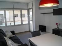 Televízia a/alebo spoločenská miestnosť v ubytovaní Urpa Apartaments