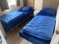 Postel nebo postele na pokoji v ubytování Vakantiepark Kijkduin - 870