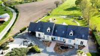 an aerial view of a house with a blue roof at Chambres d&#39;hôtes chez l&#39;habitant - Bed&amp; Breakfast homestay in Huisnes-sur-Mer