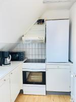 Kuchyň nebo kuchyňský kout v ubytování aday - Reberbansgade Apartment Suite