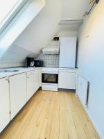 Kuchyň nebo kuchyňský kout v ubytování aday - Reberbansgade Apartment Suite