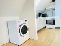 Kuchyň nebo kuchyňský kout v ubytování aday - Reberbansgade Apartment Suite