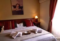 Łóżko lub łóżka w pokoju w obiekcie Hotel Borgo Antico