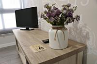 Televízia a/alebo spoločenská miestnosť v ubytovaní Apartamentos Credencial