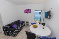 Televízia a/alebo spoločenská miestnosť v ubytovaní Apartment Paradise