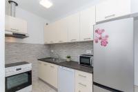 Kuchyňa alebo kuchynka v ubytovaní Apartment Paradise