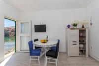 Televízia a/alebo spoločenská miestnosť v ubytovaní Apartment Paradise