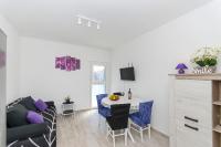 Televízia a/alebo spoločenská miestnosť v ubytovaní Apartment Paradise