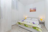 Posteľ alebo postele v izbe v ubytovaní Apartment Paradise