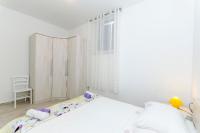 Posteľ alebo postele v izbe v ubytovaní Apartment Paradise