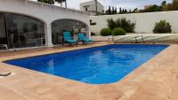 Bazén v ubytování Jávea Villa entière piscine et cuisine d'été à pinosol nebo v jeho okolí