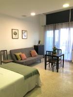Posezení v ubytování Apartamento con piscina en Ciudad Jardín