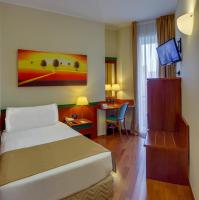 Posteľ alebo postele v izbe v ubytovaní Hotel Raffaello