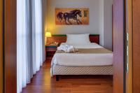 Posteľ alebo postele v izbe v ubytovaní Hotel Raffaello