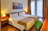 Posteľ alebo postele v izbe v ubytovaní Hotel Raffaello